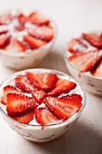 Three bowls of strawberry triamisu