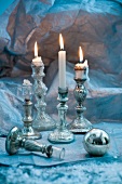 Antique silver candlesticks and Christmas bauble