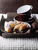 Chocolate croissants and coffee cups