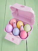 Colourful Easter eggs in an egg box
