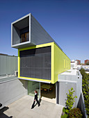 Architect-designed house constructed of three stacked, container-shaped elements