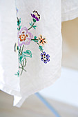 Floral embroidery on a white table cloth