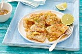 Fried cod with garlic, ginger and limes