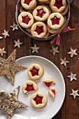 Shortbread jam-filled biscuits in a biscuit tin and on a plate