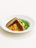 Sausages with potatoes and peas