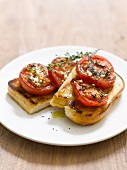 Toast topped with tomatoes and thyme