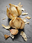 Smoked garlic on a slate surface