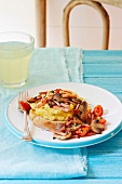 Scrambled eggs with mushrooms and cherry tomatoes on bread