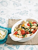 Gnocchi with spinach and tomatoes