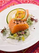 Marinated salmon on a cucumber and ginger salad with sour cream