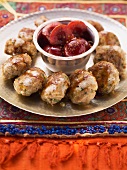 Bulgur and minced meat balls with cherry compote