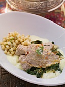 Prime boiled veal with spinach, turmeric and mustard foam and Lebanese couscous
