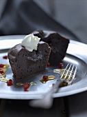 Chocolate pudding with cream and pomegranate seeds