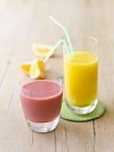 A raspberry drink and orange juice