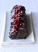 Yule log topped with redcurrants