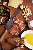 Spanish Snack Tray with Olives, Marcona Almonds, Olive Oil, Manchego Cheese, Prosciutto and Crusty Bread