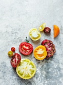 Various Sliced Heirloom Tomatoes on a Stone Surface