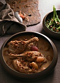 Duck legs in a dijon mustard sauce with shallots and a bean medley