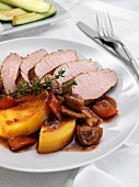 Sliced Pork Tenderloin with Roasted Vegetables and Red Wine Sauce