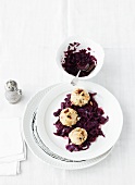 Bread dumplings with mountain cheese and red cabbage