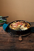 Potato bake with pointed cabbage and bacon