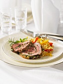 Stuffed leg of lamb with garlic, rice and peppers