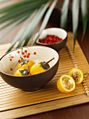 Yellow tree tomatoes in oriental bowls