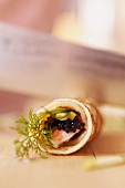 Pancake rolls filled with prawns and caviar