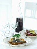 Wholemeal bread with fried herring, dill and onions for Christmas