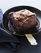 Fried beef in a pan