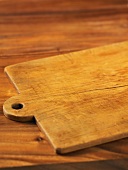 A chopping board on a wooden table