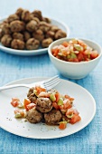 Greek meatballs with a tomato and olive salad