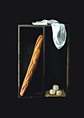 A baguette and goat's cheese in a wooden crate