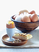 A soft boiled egg with a salt mixture and grilled pita bread
