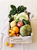 Vegetables and fruit in a wooden crate