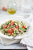 Quinoa salad with cherry tomatoes, cucumbers and chickpeas