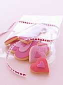 Pink heart-shaped biscuits with a gift ribbon
