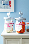 Storage jars with doilies used as labels