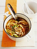 Asian chicken soup with mushrooms and noodles
