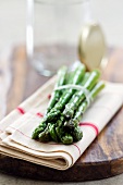 Green asparagus on tea towel