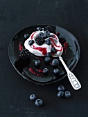 Yogurt cream with blueberries and blackberries