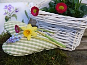 Spring decoration: fabric heart and basket of spring flowers