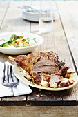Leg of lamb with garlic and vegetables