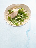 Noodle soup with sea bass and sugar snap peas