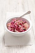 Potato and beetroot salad with ham, onion and a horseradish dressing