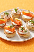 Blinis topped with smoked salmon and chicken
