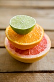 Half a grapefruit, half an orange and half a lime, stacked