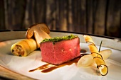 Saddle of venison with a herb crust and sides