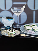 Herb sandwiches with caviar and a Gibson cocktail