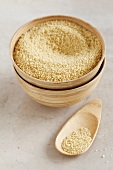 Couscous in a wooden bowl with a spoon